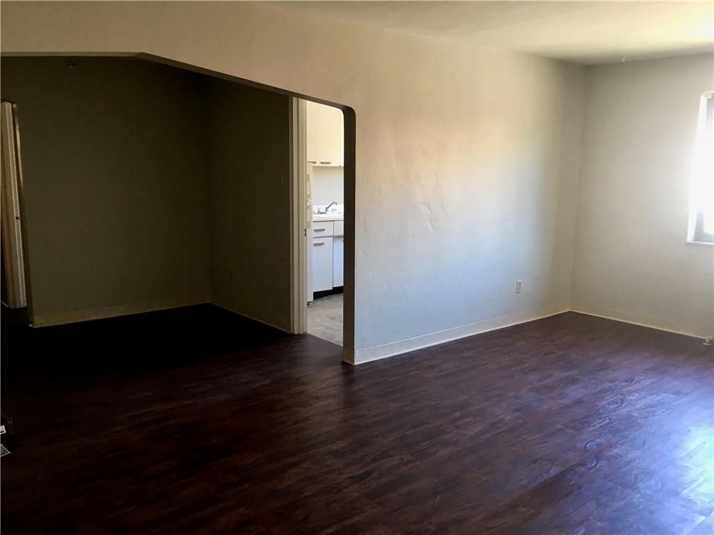 666 Florida Pittsburgh, PA 15228 - Photo 3 of 7 an empty room with wooden floor and windows