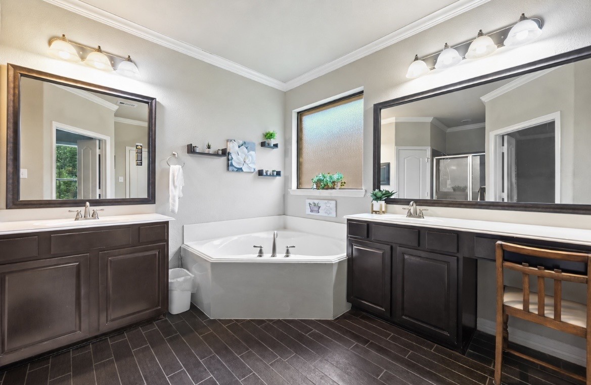 2004 Brabner Way Conroe, TX 77301 - Photo 9 of 15 Dual Vanities • Relaxing Soaking Tub