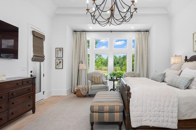 a bathroom with a double vanity sink mirror and next to a window