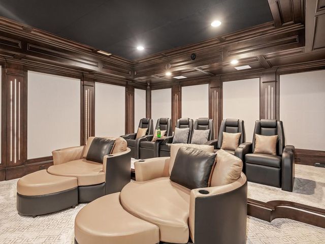 a kitchen with a sink and chairs