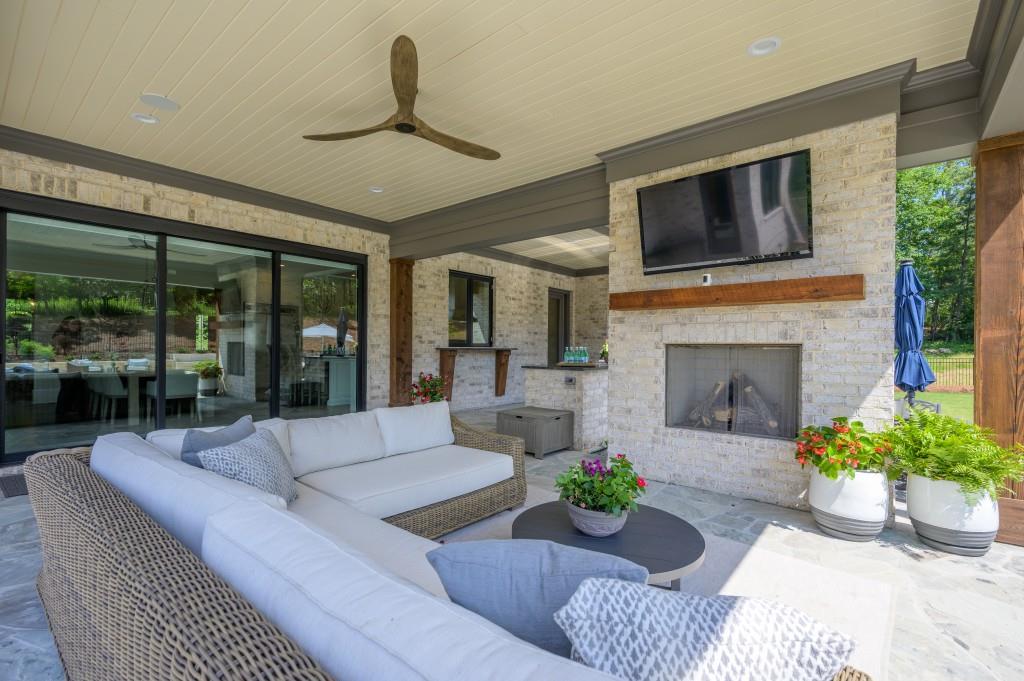 10155 Cedar Ridge Drive Milton, GA 30004 - Photo 41 of 44 a living room with furniture fireplace and potted plants