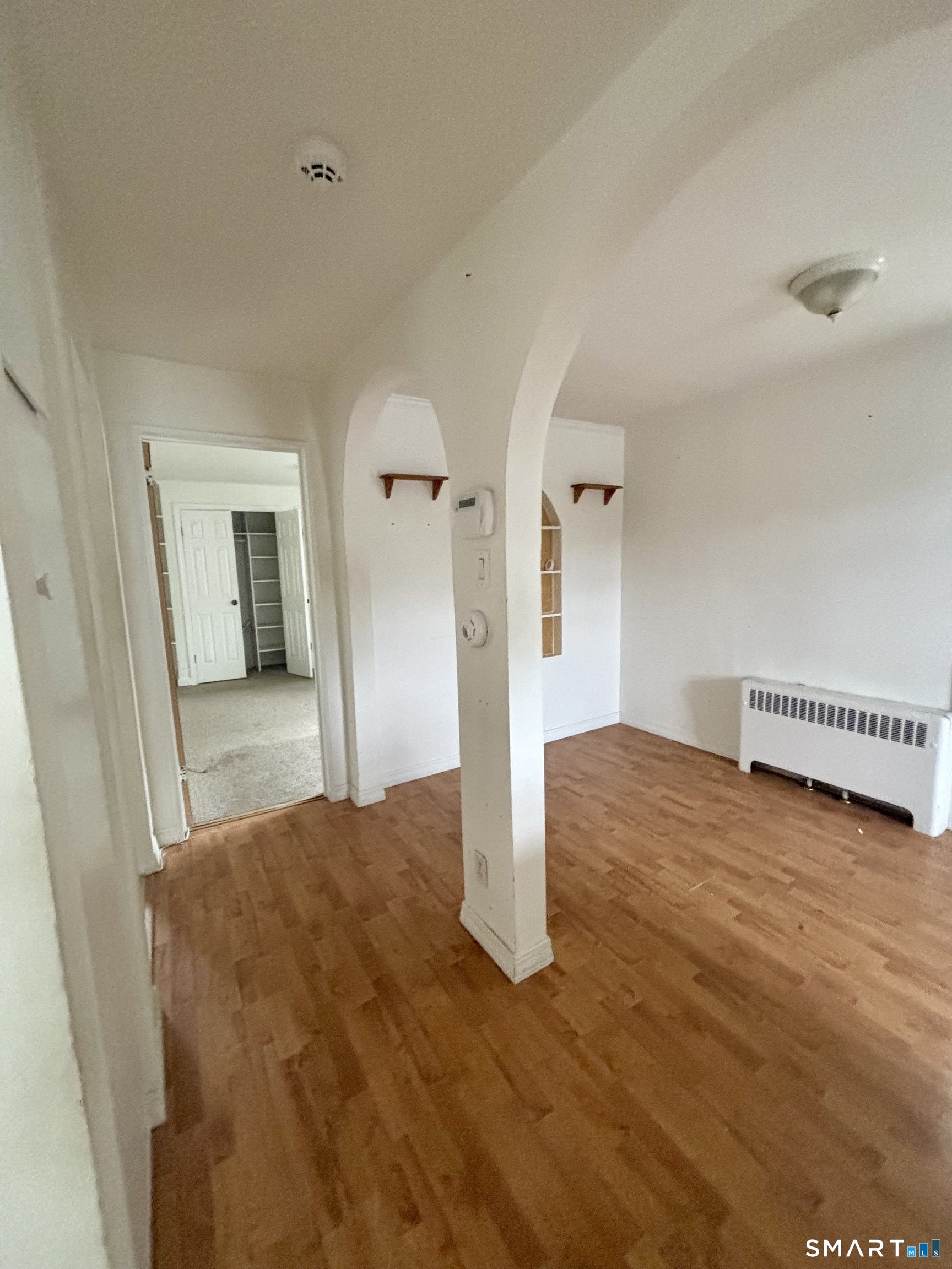 74 Standish Road, Unit 3 Stamford, CT 06902 - Photo 10 of 22 a bedroom with a bed and a dresser