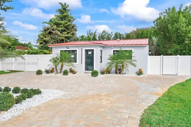 an empty room with a ceiling fan and window