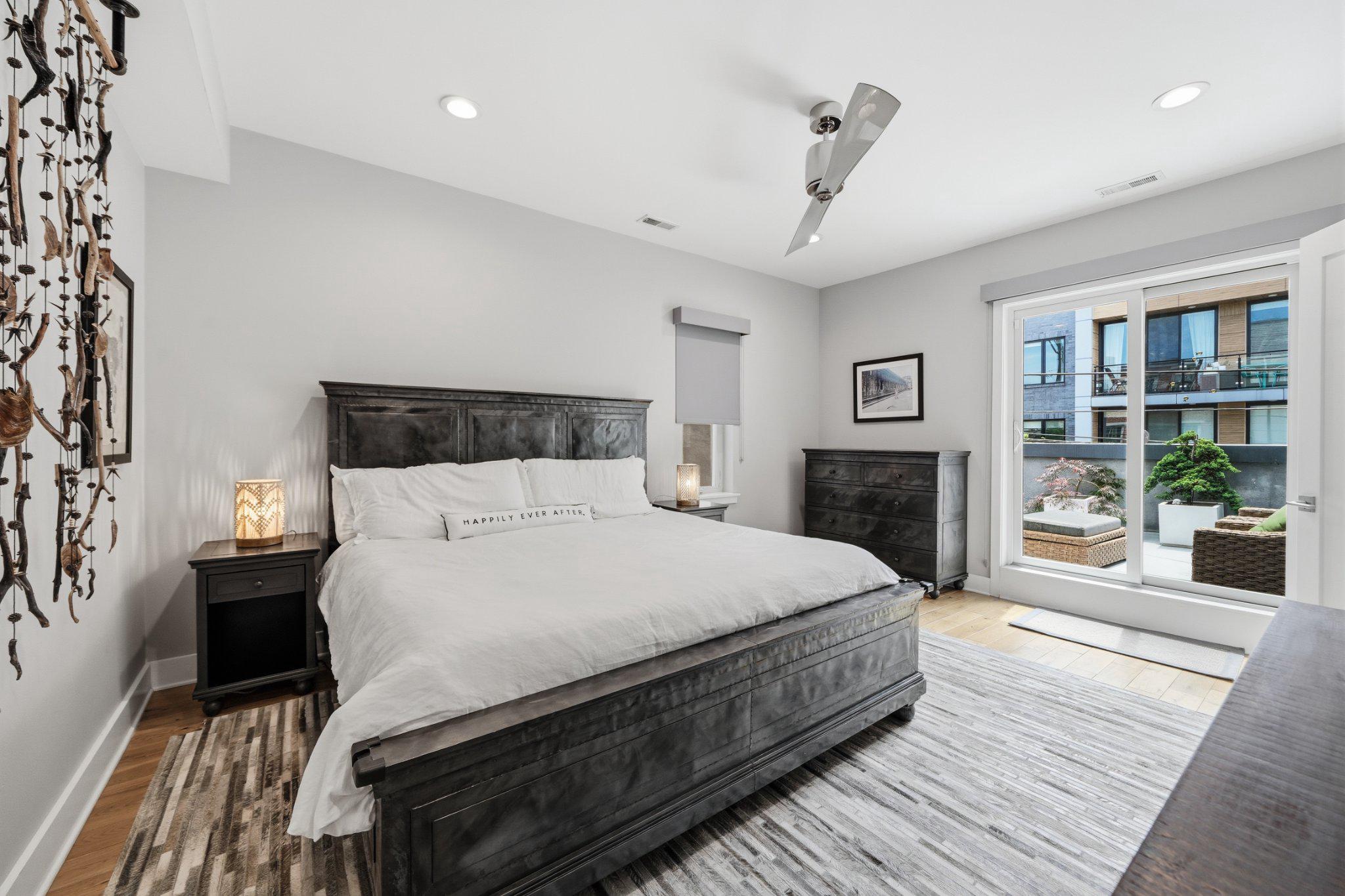 237 West Thompson Street Philadelphia, PA 19122 - Photo 22 of 35 Primary bedroom w/ natural light & deck access.