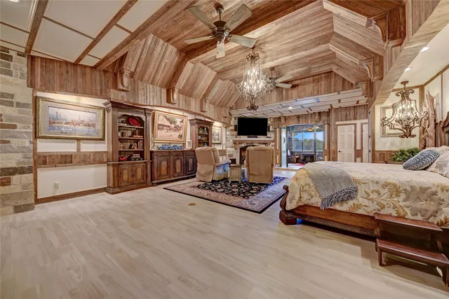 a dining area with furniture and a painting on the wall