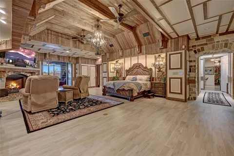 a spacious bedroom with a bed and a table