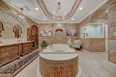 a view of a dining room with furniture a chandelier and wooden floor