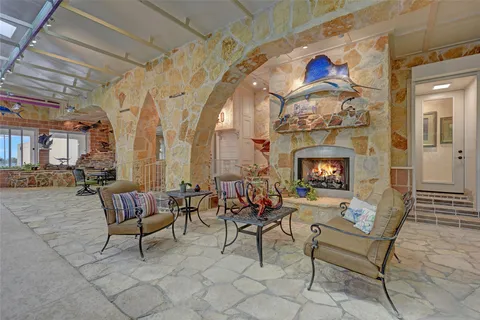a view of a patio with table and chairs
