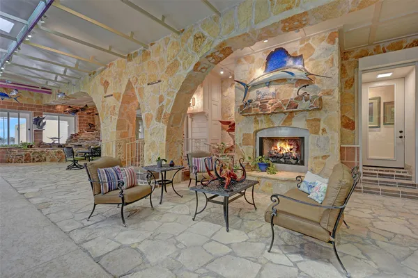 a view of a patio with table and chairs