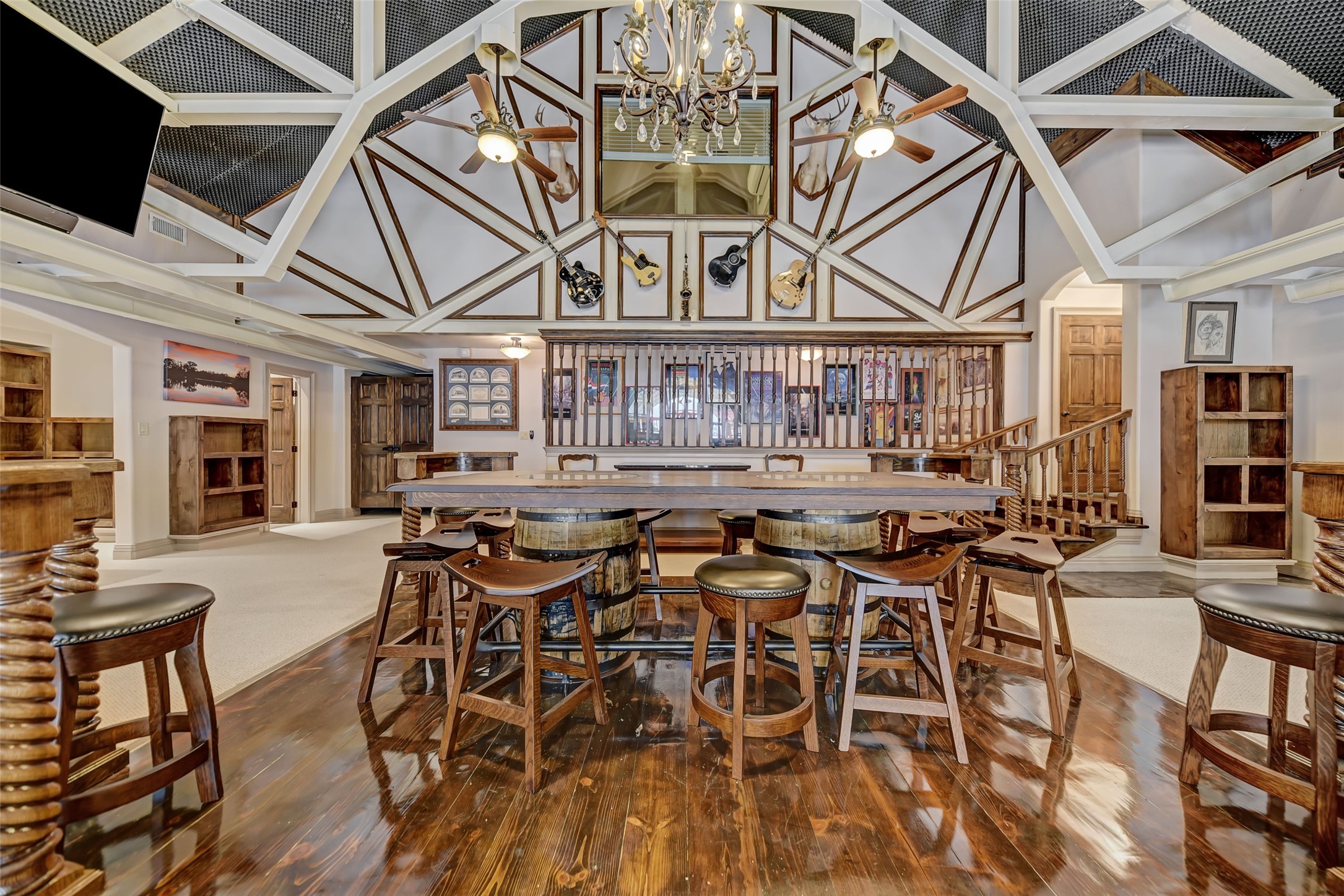 9950 Palestine Road Brenham, TX 77833 - Photo 25 of 49 The main upstairs game room is located on the second floor with a view of the beautiful great room below. This remarkable game room features wood and carpeted floors, immense architectural detail, 3 large storage rooms, a half bath, and library space with built-in shelves. Located adjacent to the game room you will find 3,400+ SF of unfinished flex space with bedroom and plumbing for a full bath.