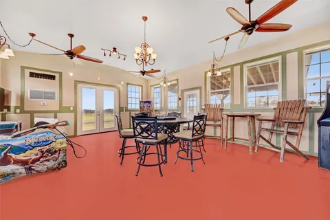 a room with gym equipment and a flat screen tv