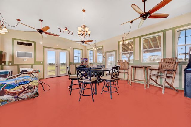 a room with gym equipment and a flat screen tv