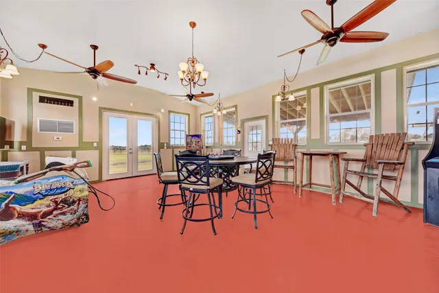 a room with gym equipment and a flat screen tv