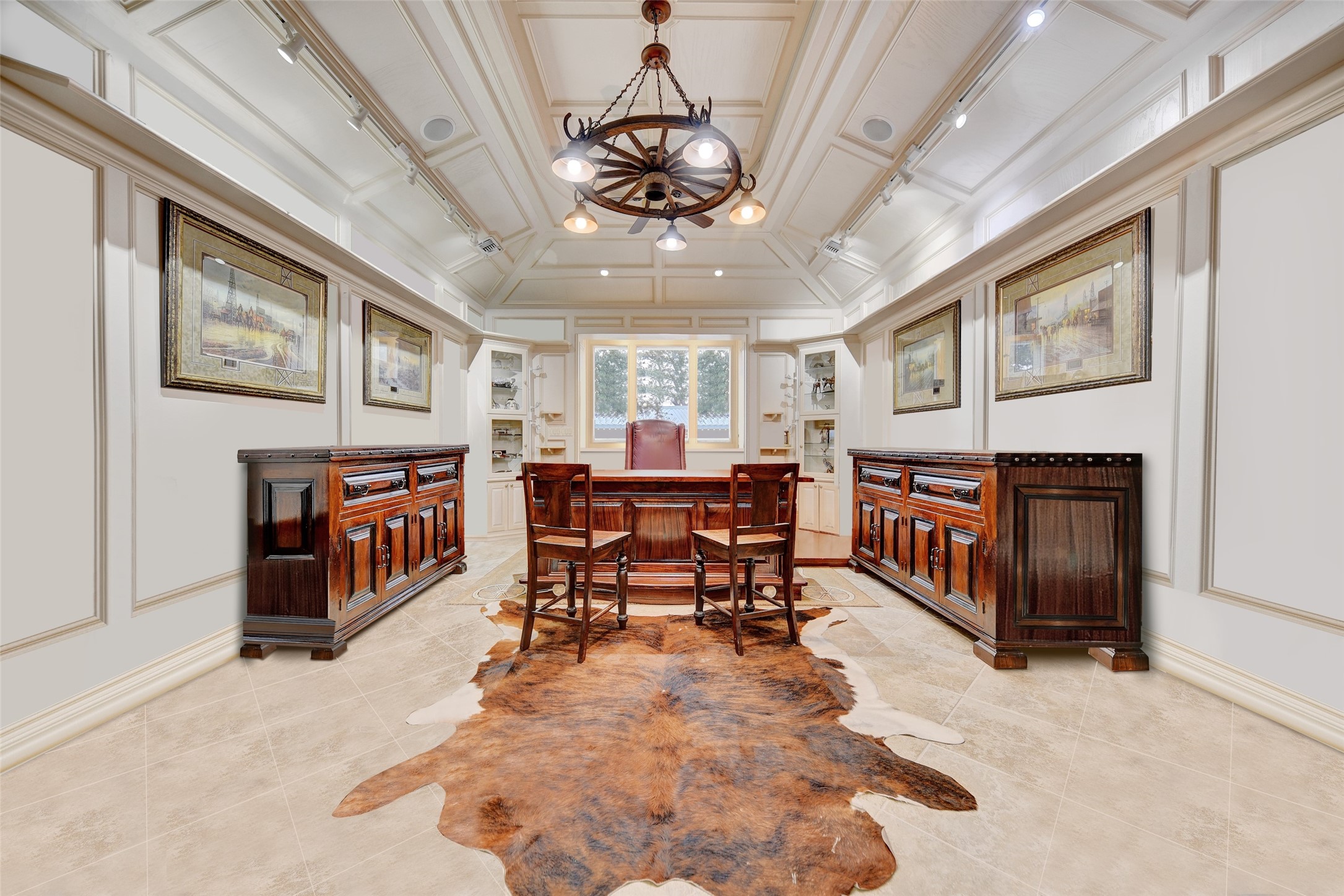 9950 Palestine Road Brenham, TX 77833 - Photo 30 of 49 The study is complete with leaded glass pocket doors surrounded by custom solid wood walls, cathedral ceilings highlighted by a custom chandelier and extensive wood molding, an elevated desk area anchored by built-ins, flush mount speakers, and panoramic views of the land.