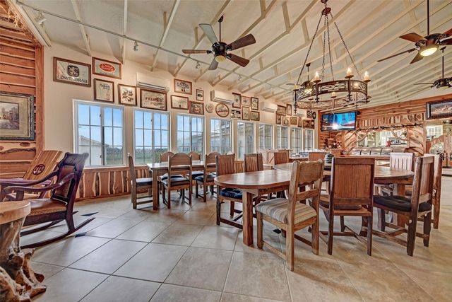 a view of a big dining room with furniture