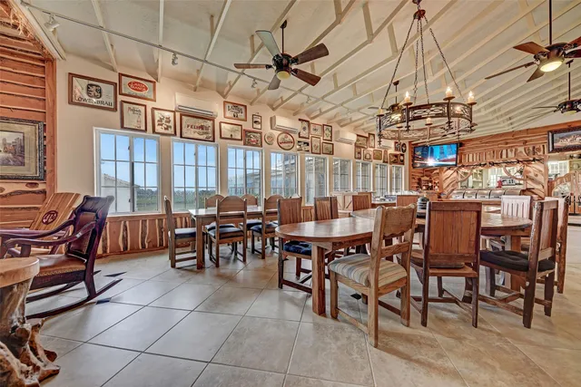 a view of a big dining room with furniture
