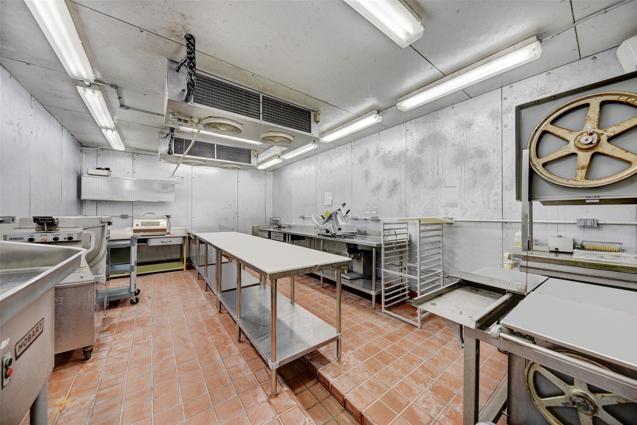 9950 Palestine Road Brenham, TX 77833 - Photo 37 of 49 The processing room has dual Bally A/C coolers allowing it to also be an additional walk-in fridge, making it the third. The drainage system in the floor conveniently drains directly outside.