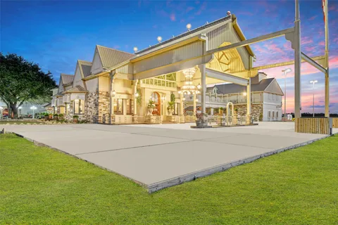 an aerial view of residential houses with outdoor space and river