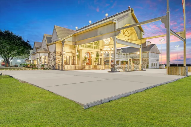 an aerial view of residential houses with outdoor space and river