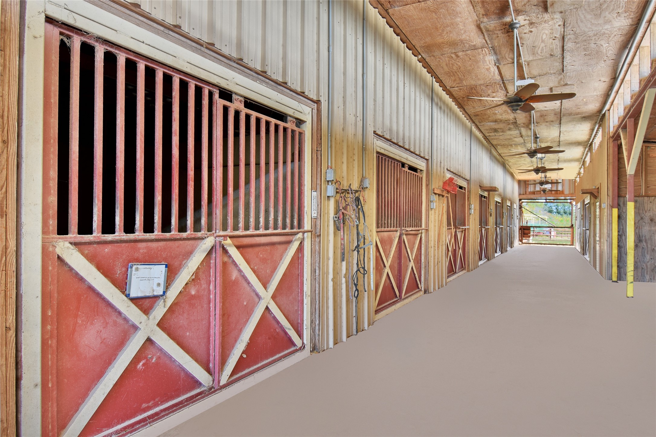 9950 Palestine Road Brenham, TX 77833 - Photo 7 of 49 Equestrian facilities designed to support breeding, performance, and recreational riding! The horse barn is complete with 19 stalls, 3 stocks with foal stalls, a breeding mount, and vet's office. Adjacent to the barn is a covered 50' round working pen and a motorized hot walk.