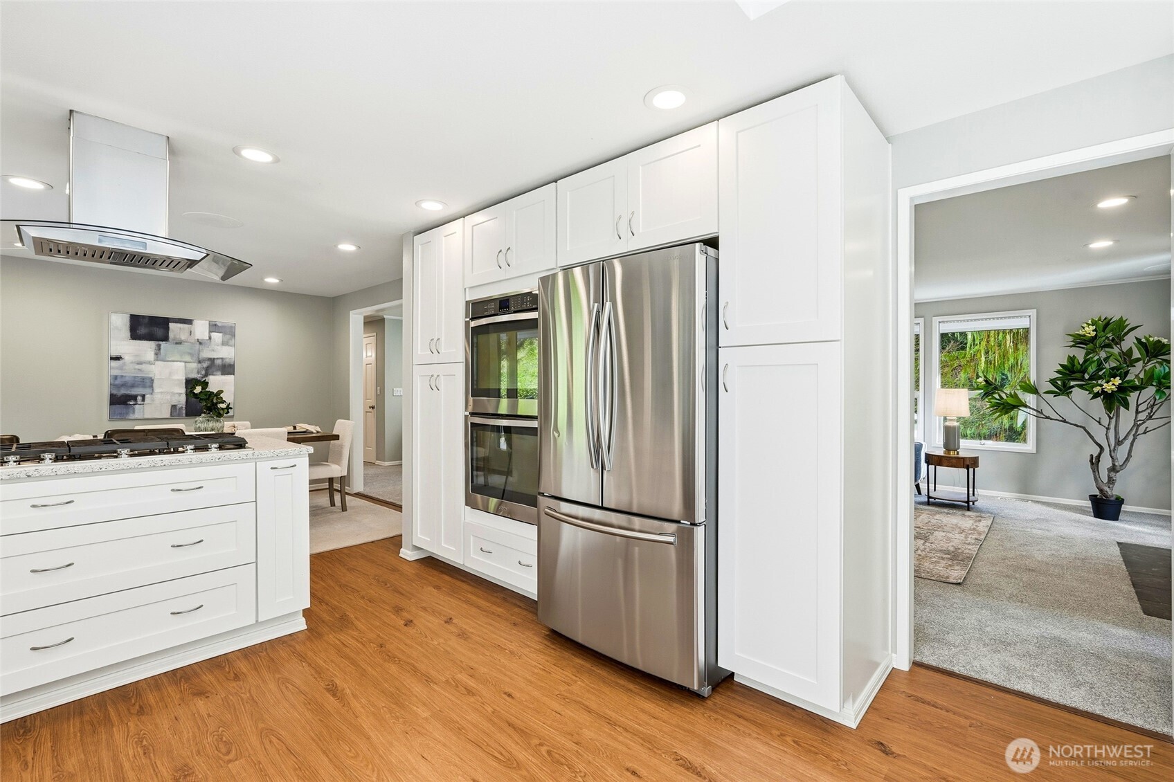 4822 Fowler Avenue Everett, WA 98203 - Photo 11 of 40 a kitchen with a refrigerator and a stove top oven