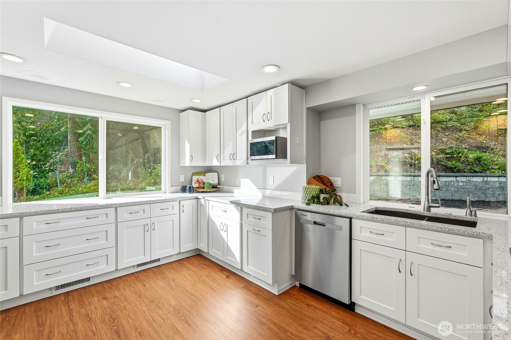 4822 Fowler Avenue Everett, WA 98203 - Photo 6 of 40 a kitchen with granite countertop white cabinets and window