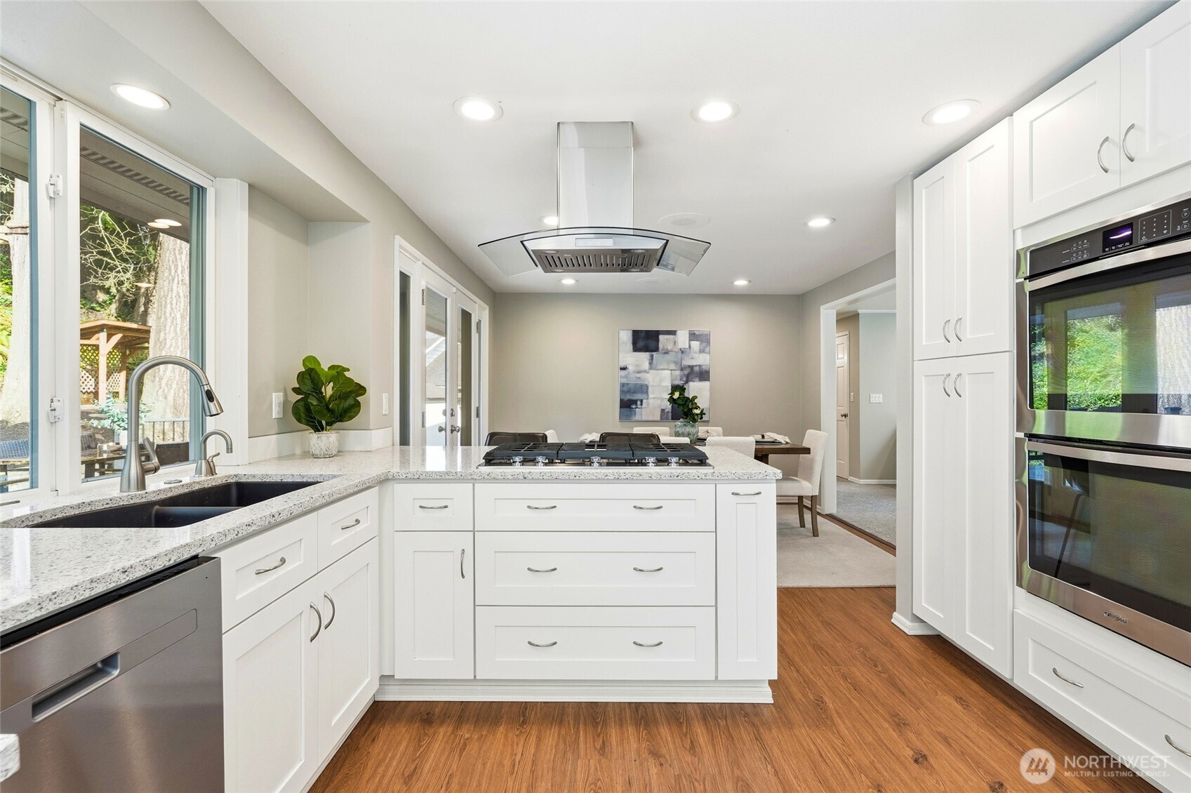4822 Fowler Avenue Everett, WA 98203 - Photo 8 of 40 a kitchen with stainless steel appliances kitchen island granite countertop a stove a sink and a refrigerator