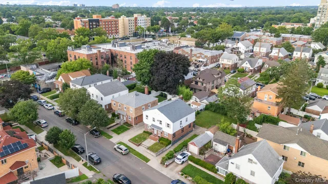 an aerial view of residential houses with outdoor space
