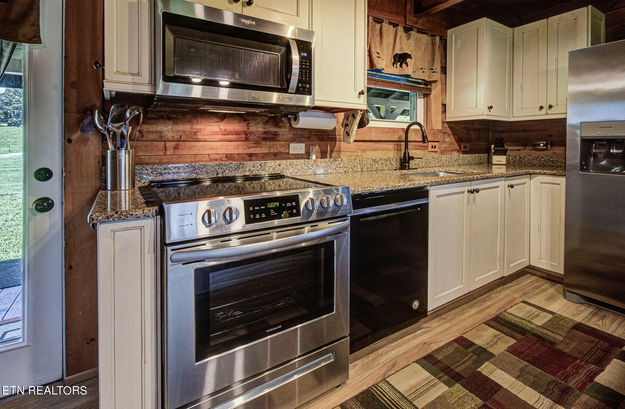 433 Brakebill School Road Madisonville, TN 37354 - Photo 11 of 60 a kitchen with a stove and a microwave