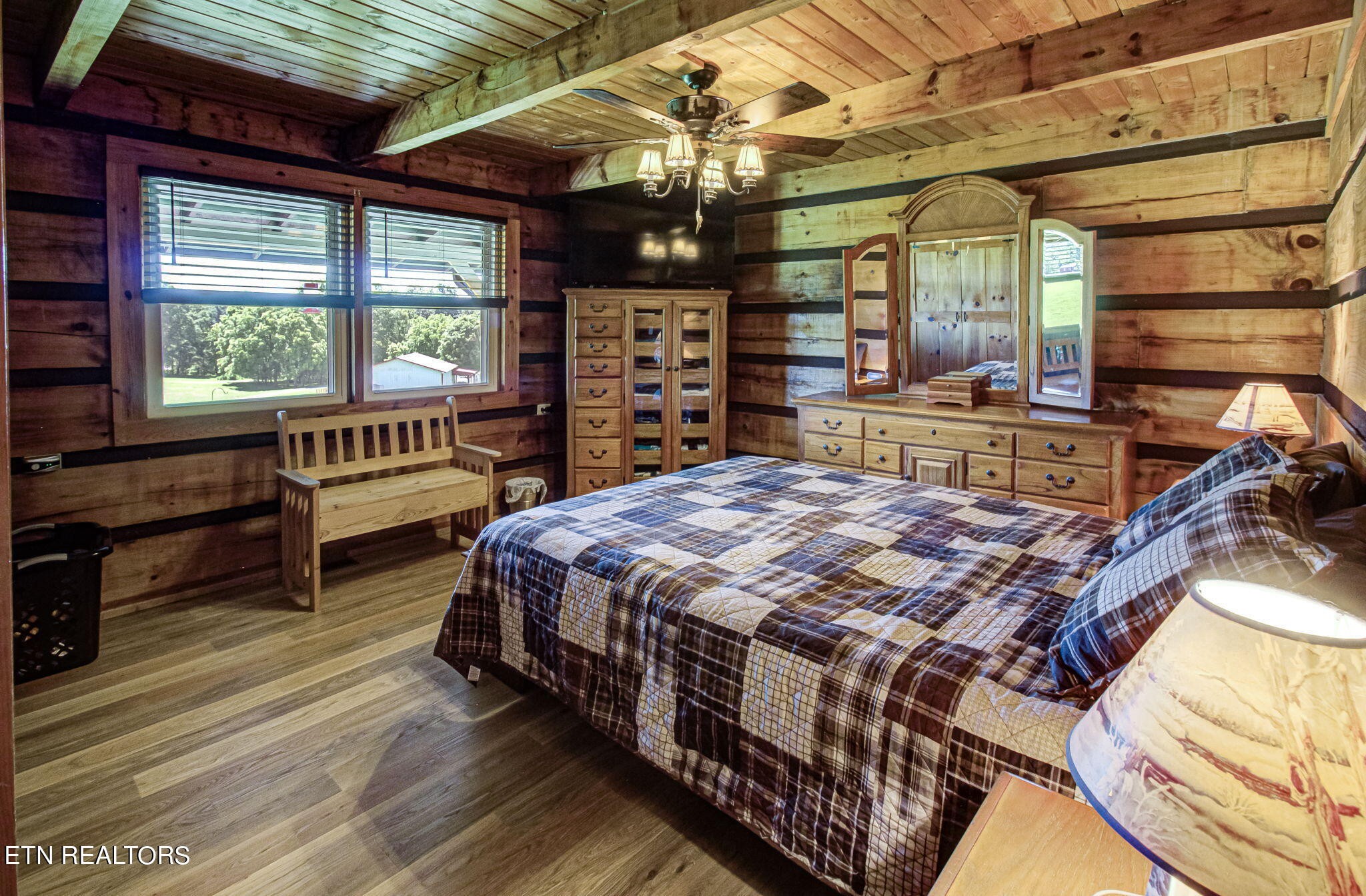 433 Brakebill School Road Madisonville, TN 37354 - Photo 25 of 60 a bed sitting in a bedroom next to a window