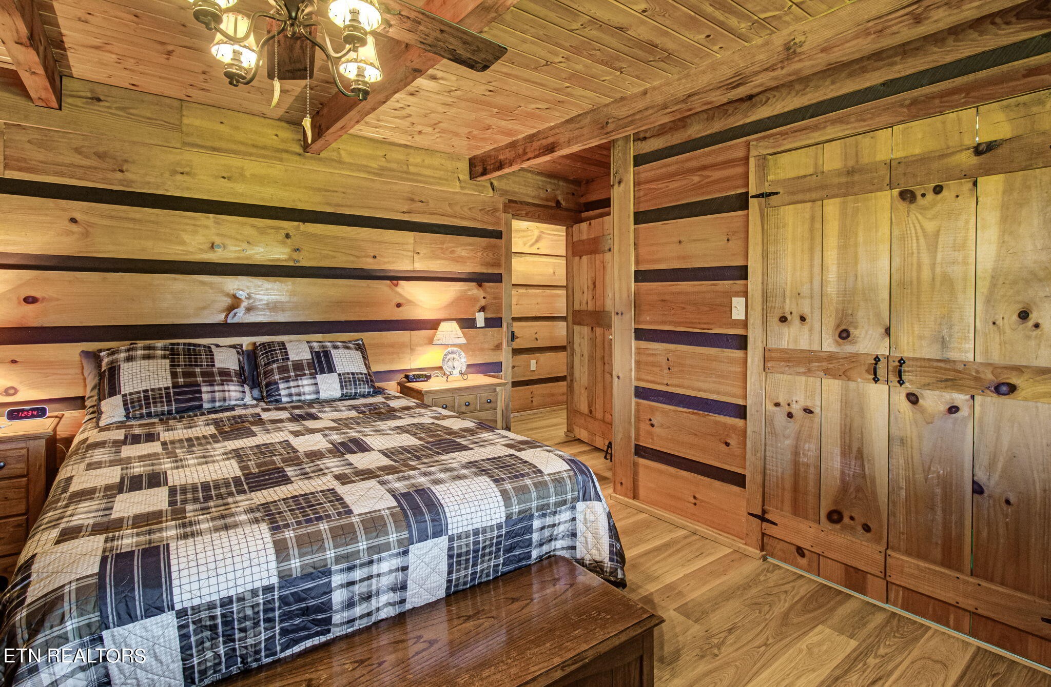 433 Brakebill School Road Madisonville, TN 37354 - Photo 26 of 60 a bedroom with a bed a dresser and with the shower