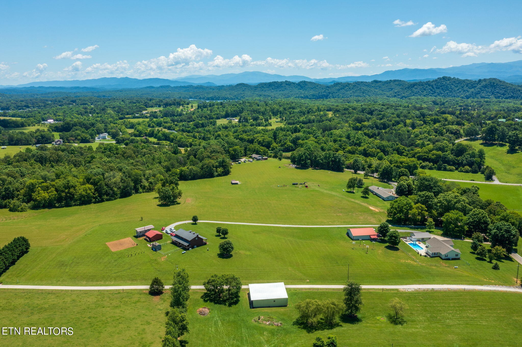 433 Brakebill School Road Madisonville, TN 37354 - Photo 57 of 60 a view of a field with grass and houses