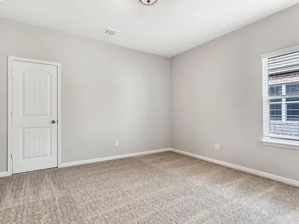 a room with a window and closet