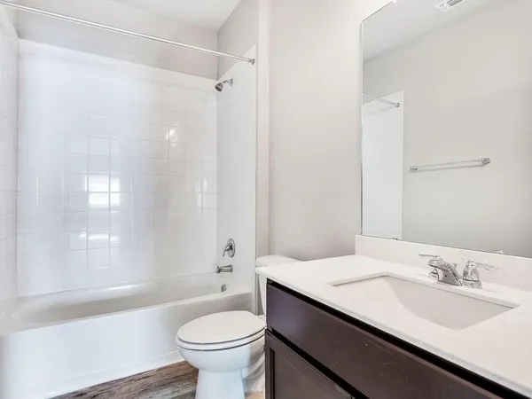 a bathroom with a sink a toilet and a bathtub