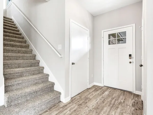 a view of entryway with wooden floor