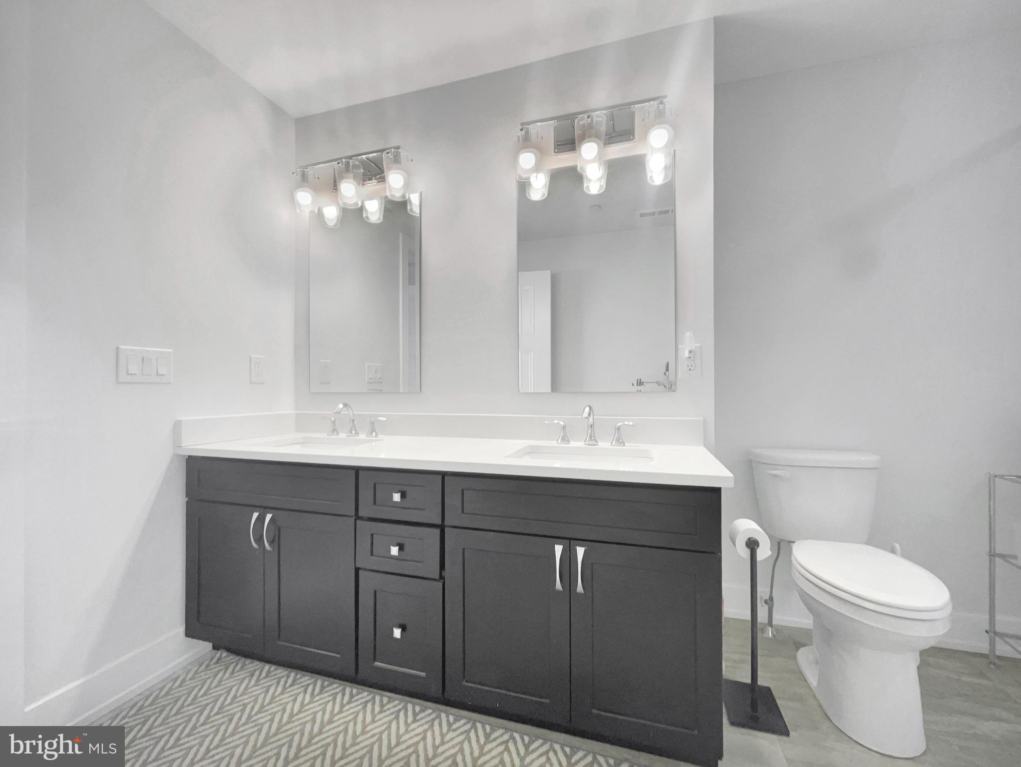 2001 Hyview Terrace Dresher, PA 19025 - Photo 11 of 26 a bathroom with a toilet a sink and mirror