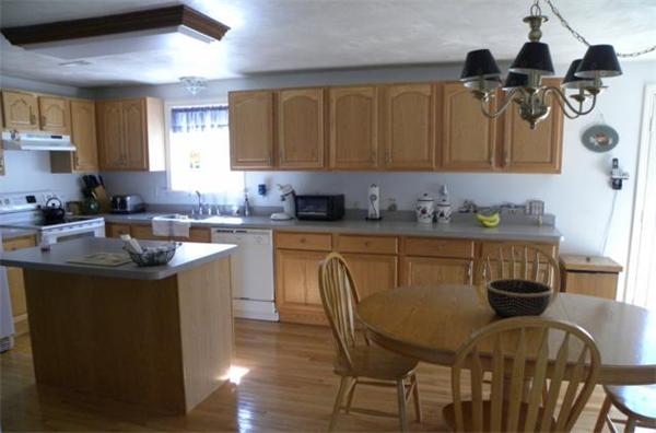 2 Nelson Road Charlton, MA 01507 - Photo 8 of 23 a kitchen with stainless steel appliances granite countertop a sink a stove and a wooden floors