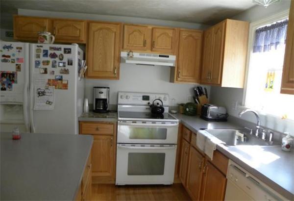 2 Nelson Road Charlton, MA 01507 - Photo 9 of 23 a kitchen with stainless steel appliances granite countertop a stove a sink and a refrigerator