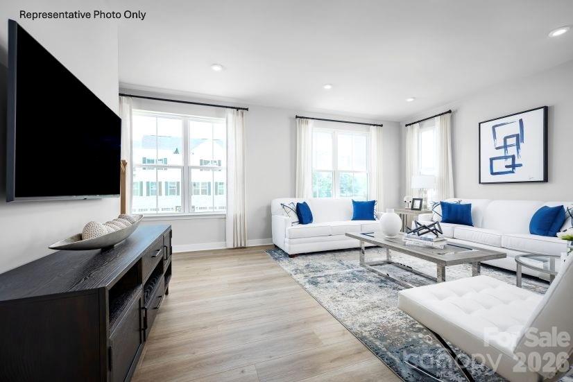 2283 Flicker Road, Unit 1050C Indian Land, SC 29707 - Photo 3 of 17 a living room with furniture and a flat screen tv