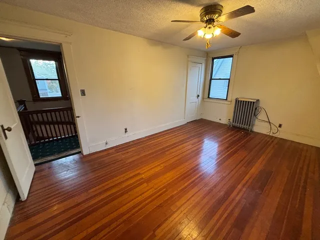 wooden floor and window in an empty room