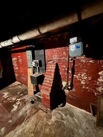 a view of a big house with a big yard and large trees