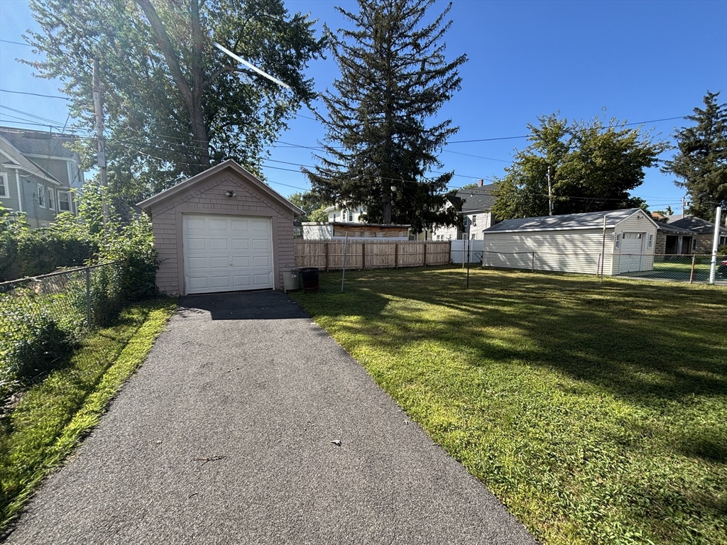 88 Dunmoreland Street Springfield, MA 01109 - Photo 29 of 29 a front view of a house with a yard