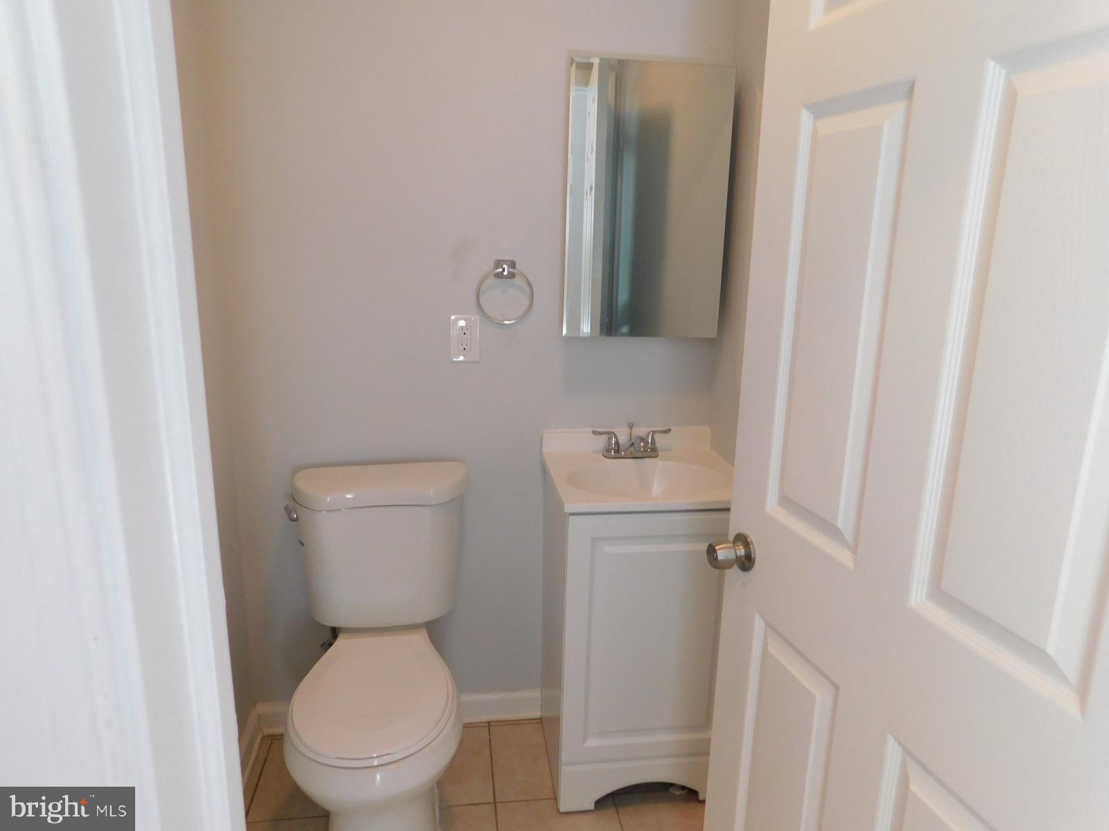 2238 Master Street Philadelphia, PA 19121 - Photo 5 of 24 a white toilet sitting next to a bathroom sink