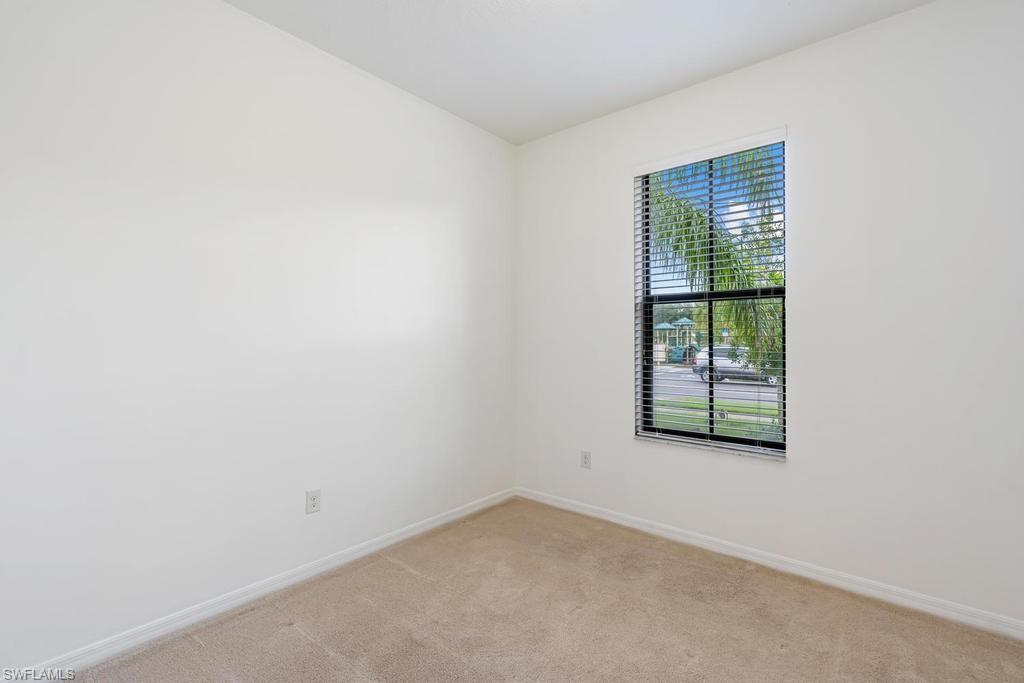 5423 Useppa Drive Ave Maria, FL 34142 - Photo 13 of 35 an empty room with windows