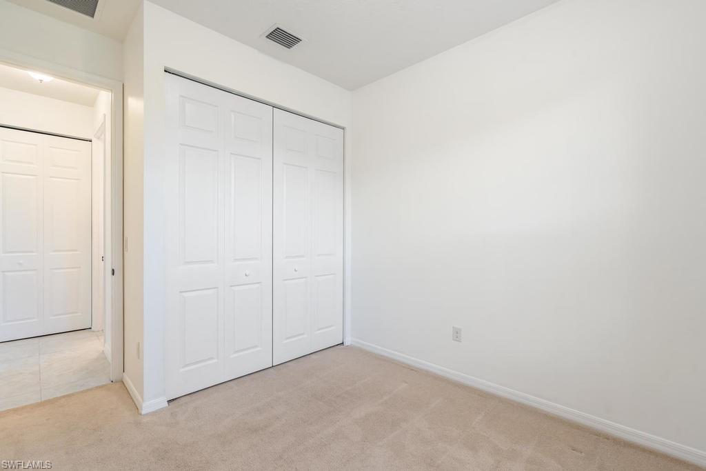 5423 Useppa Drive Ave Maria, FL 34142 - Photo 14 of 35 an empty room with closet area