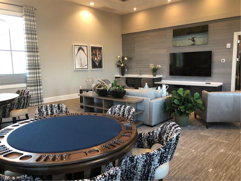 5423 Useppa Drive Ave Maria, FL 34142 - Photo 28 of 35 a living room with furniture and a flat screen tv