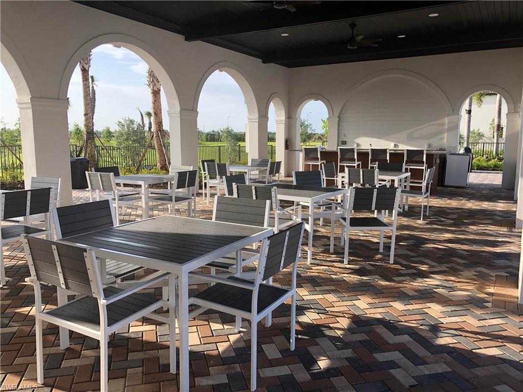 5423 Useppa Drive Ave Maria, FL 34142 - Photo 32 of 35 a view of a dining room with furniture window and outside view