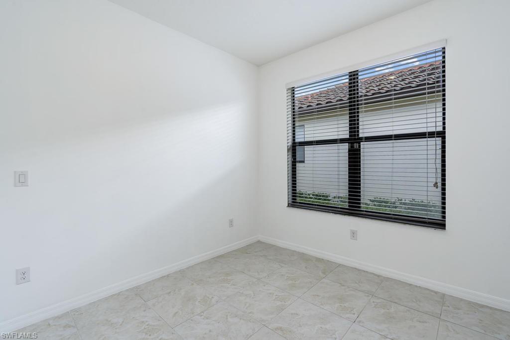 5423 Useppa Drive Ave Maria, FL 34142 - Photo 10 of 35 an empty room with windows