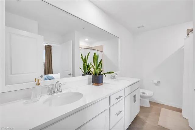 a bathroom with a shower and toilet