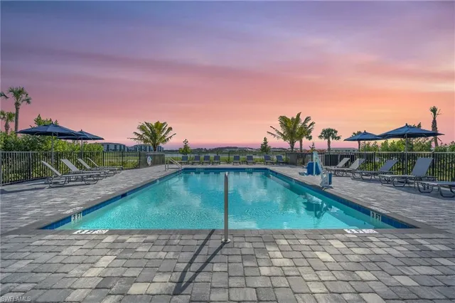 a view of a patio with swimming pool